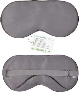 a grey sleeping mask and a white card