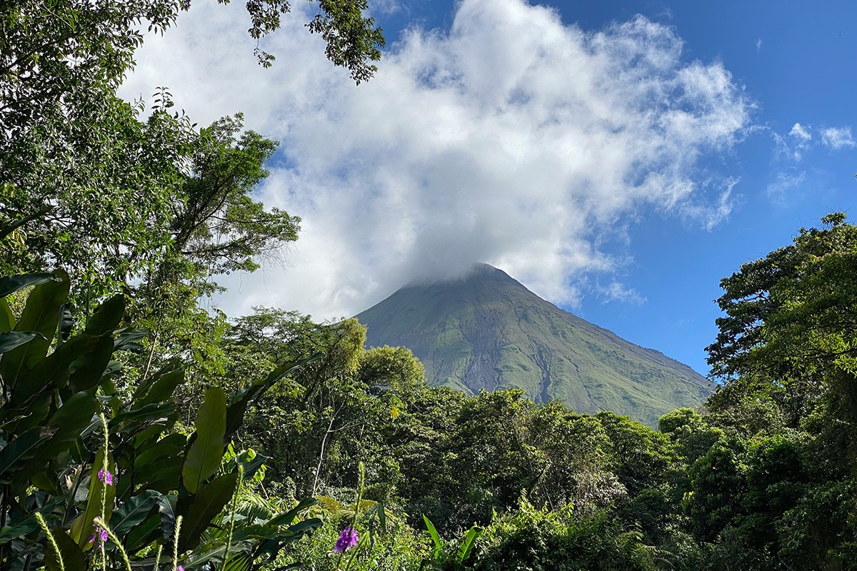 costa-rica-digital-nomad-visa-arenal-volcano Arenal Volcano with trees and clouds