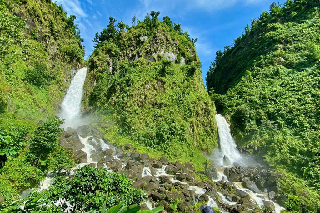 dominica-digital-nomad-visa-trafalgar-waterfalls two cliffside waterfalls with lush green foliage
