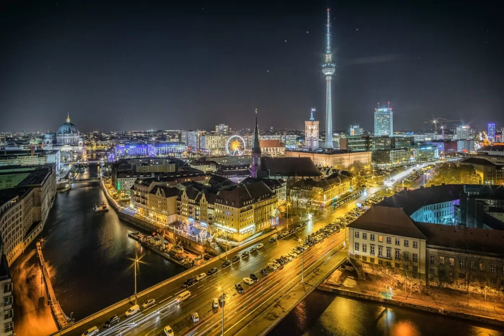 City view of Berlin with lights at night over the River Spress
