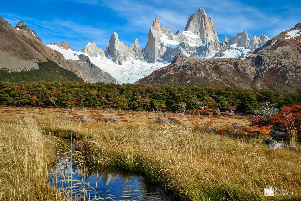 off-the-beaten-path-destinations-patagonia-argentina mountain view with a creek grass and forest in Patagonia Argentina